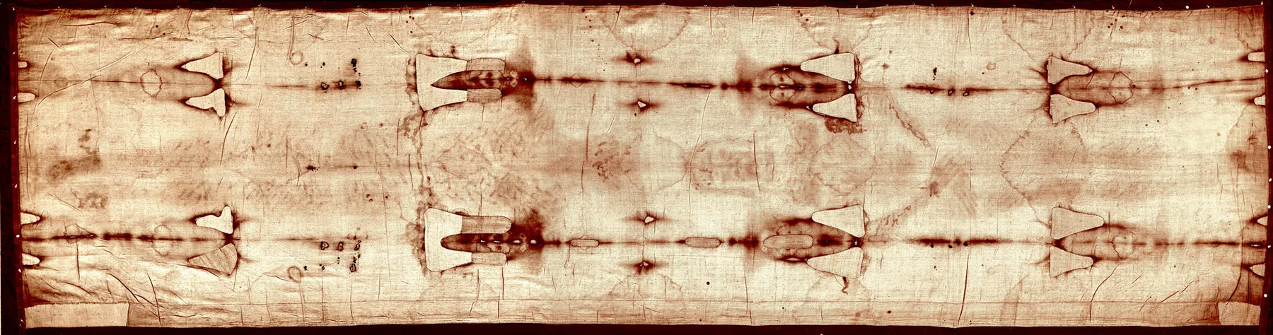 The full length of the Shroud of Turin, showing the front and back images of a man laid head to head